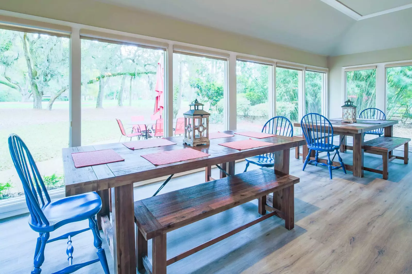 You may comfortably seat 6 people at each of the two dining tables.