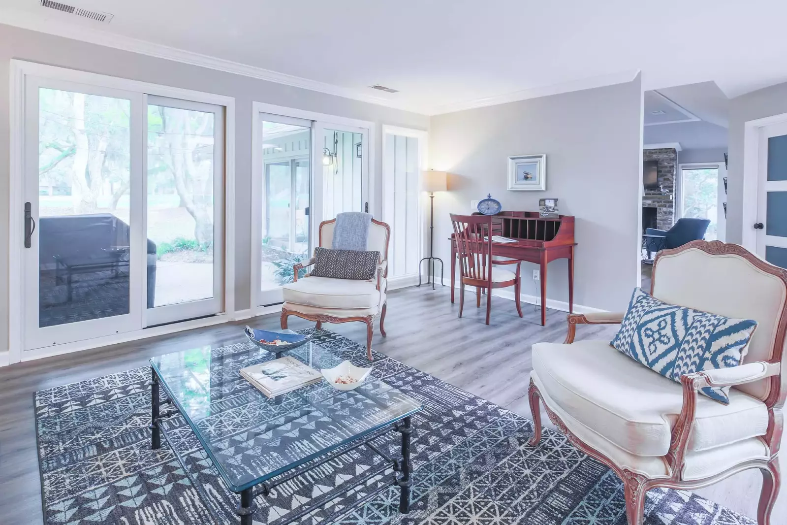 The living room is located on the other side of the kitchen.