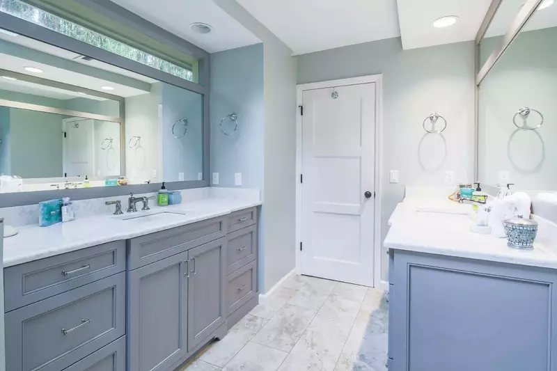 The en suite bathroom features two spacious vanities.