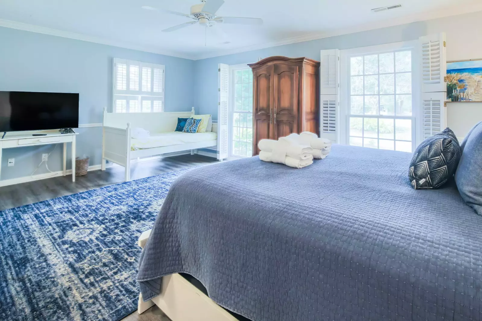 The second master suite also has a twin day bed, armoire and flat screen TV.