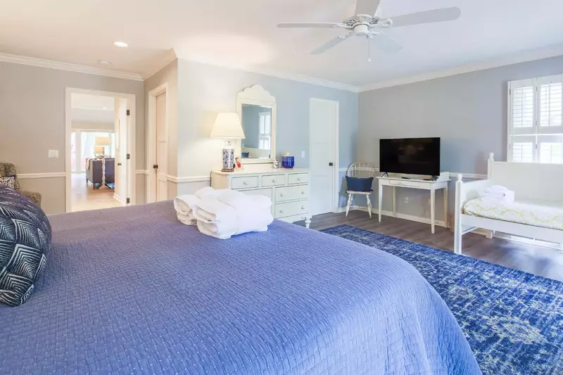 The second master suite also has a dresser, ceiling fan and en suite bathroom.