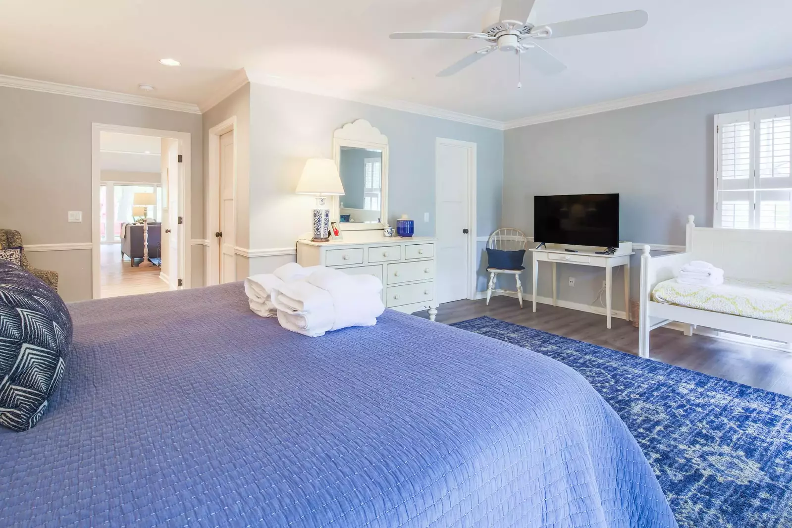 The second master suite also has a dresser, ceiling fan and en suite bathroom.