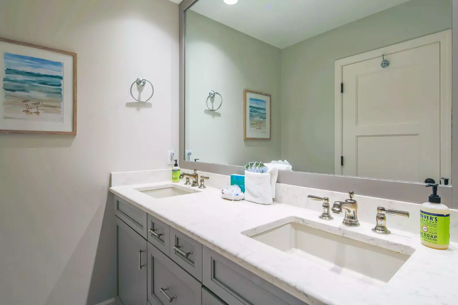 The en suite bathroom features a dual sink vanity.