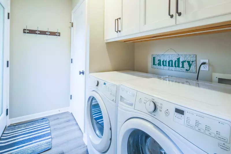There is a full-sized washing machine and dryer located within the home.