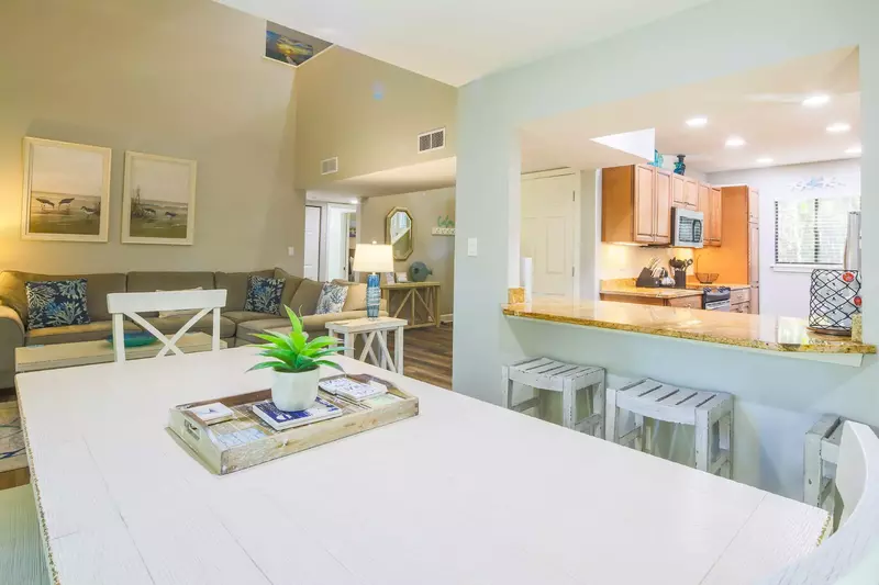 The open layout makes it easy to interact with your guests in the kitchen, living room and dining area.