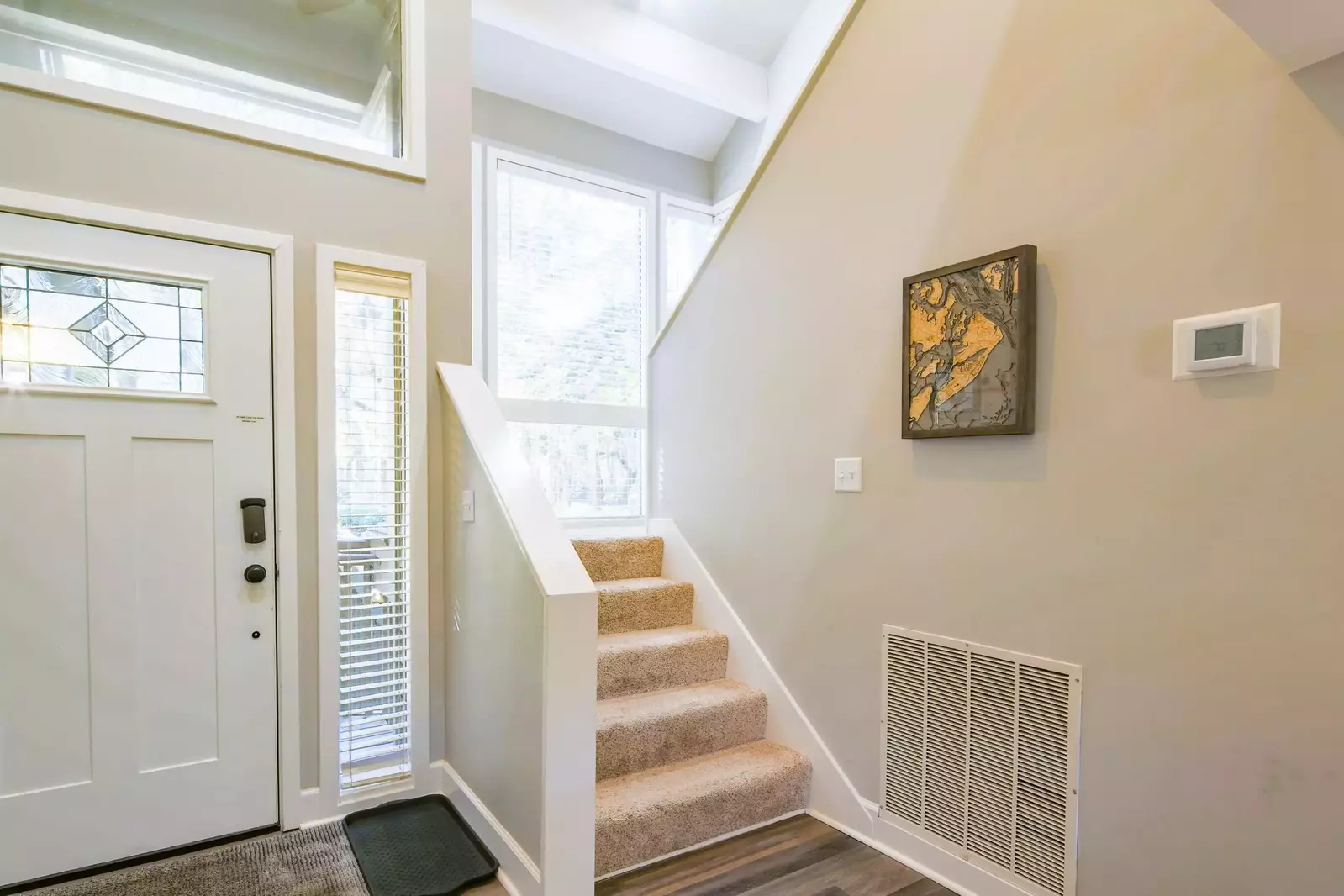 This stairway near the front door leads to the loft and the master suite.