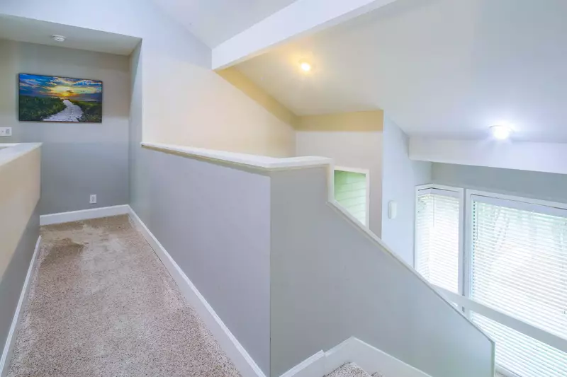 This walkway at the top of the stairs leads to the master suite.