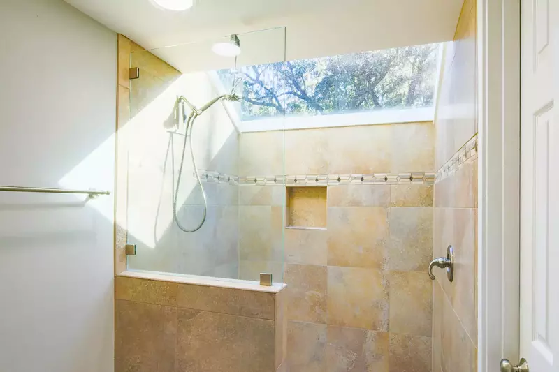 This en suite bathroom for the master suite also has a beautifully tiled, walk-in shower.