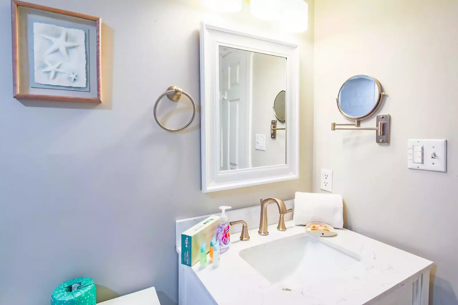 This en suite bathroom for the features a spacious vanity.