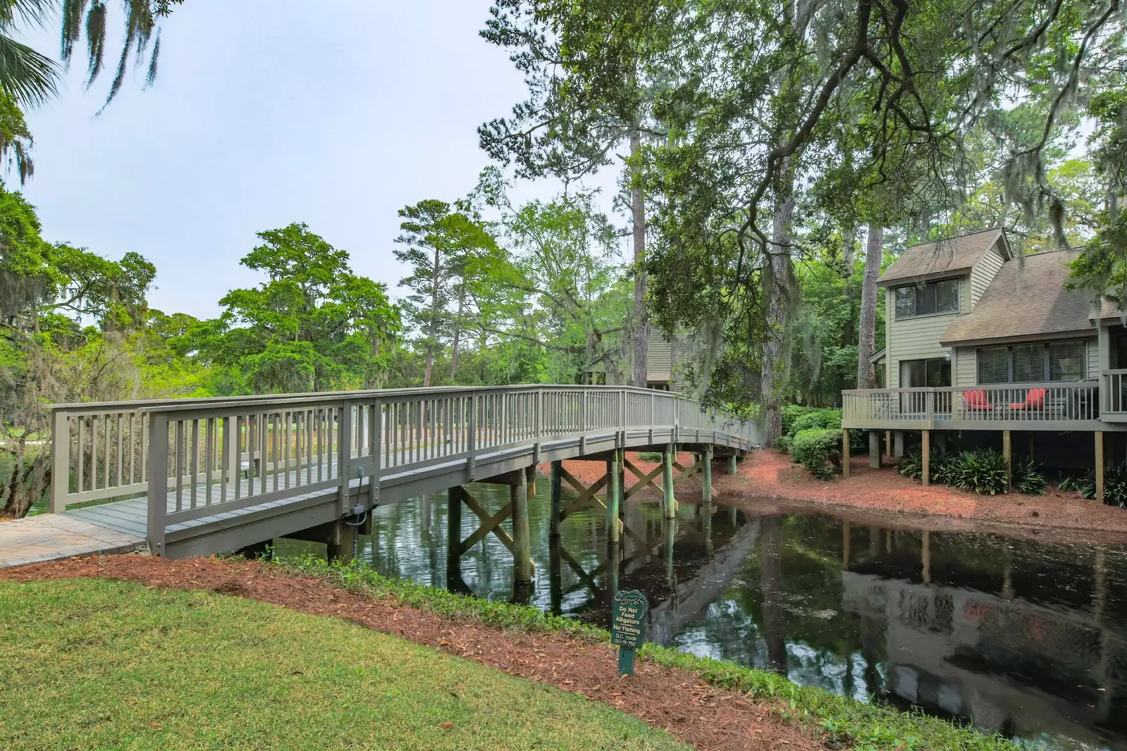 Follow this bridge to cross the lagoon and access the community pool.