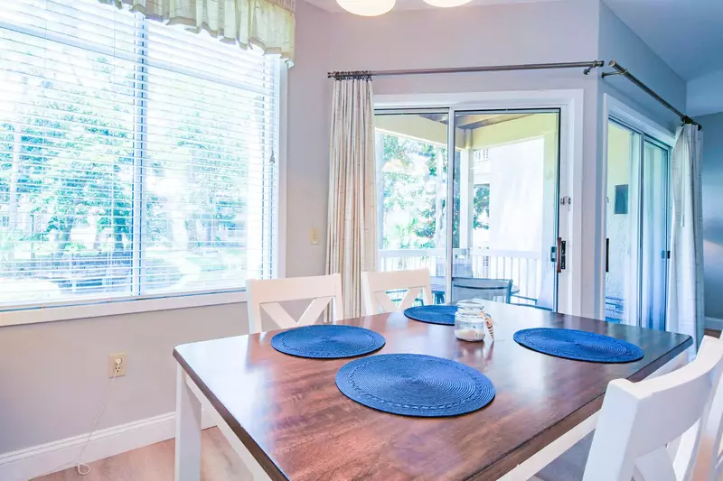 There is also an outdoor dining table on the covered balcony off of the dining area and living room.