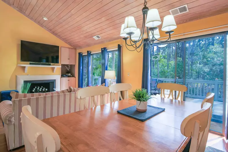 You can access the back deck from the sliding glass doors in the living room and the dining area.