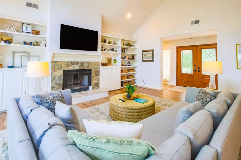 When you enter the home, you'll find this beautiful living room with vaulted ceilings and sectional sofa.