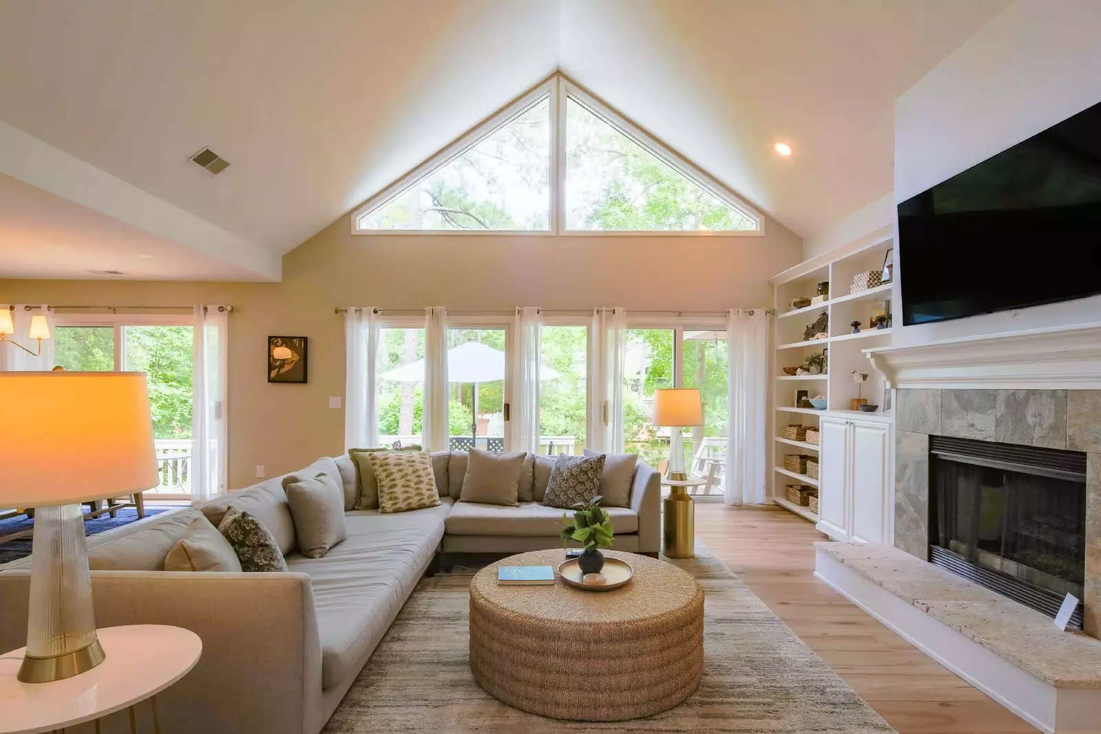 The sliding glass doors in the living room lead to the home's back deck and pool patio.