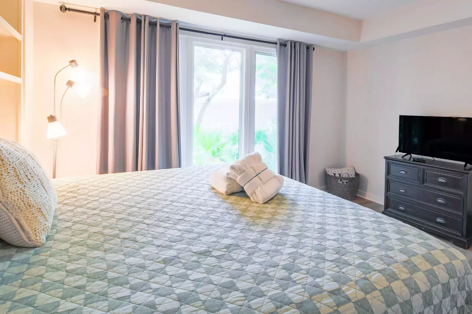 This room also has a dresser and flat screen TV.