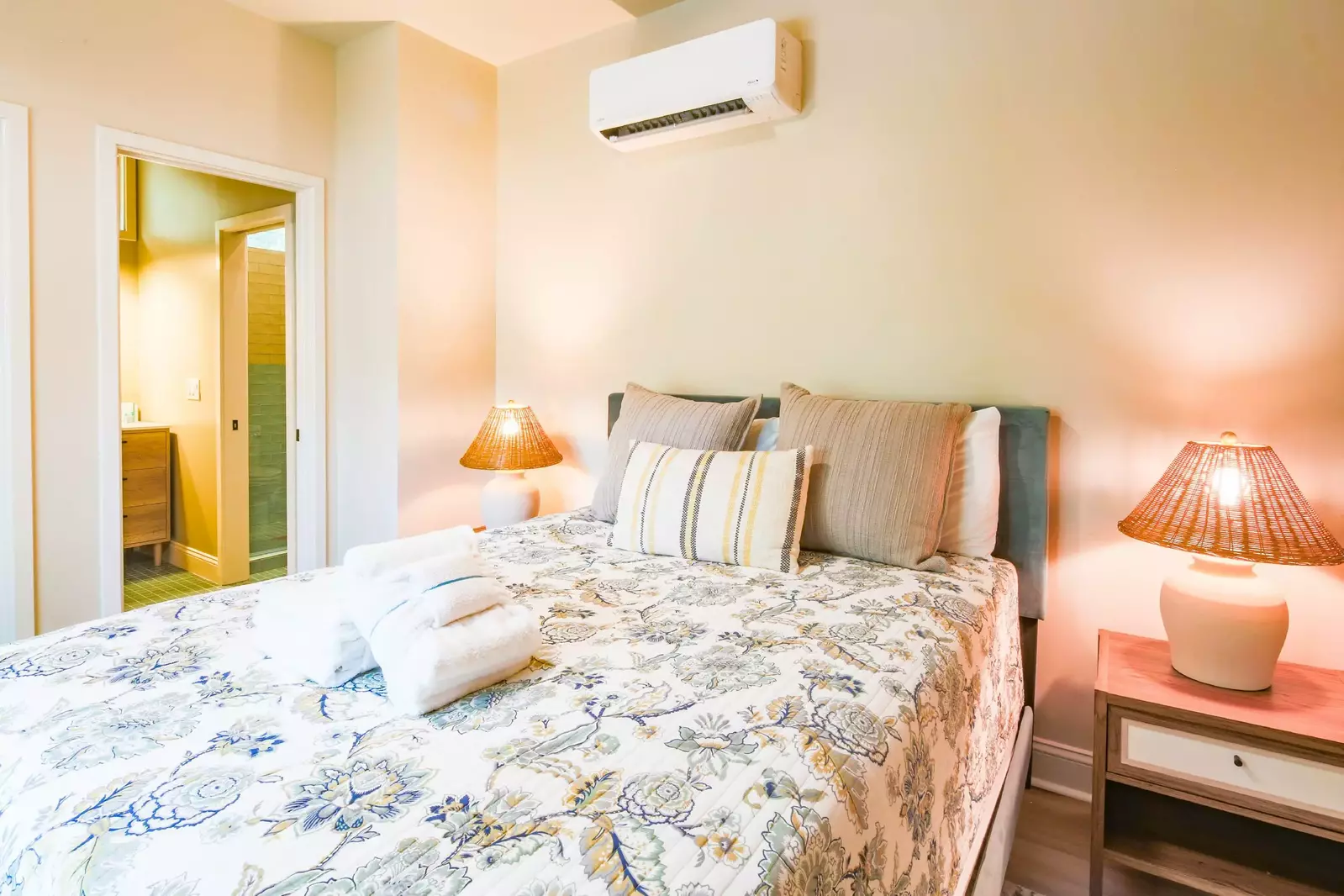 This guest bedroom shares access to a jack & jill bathroom.