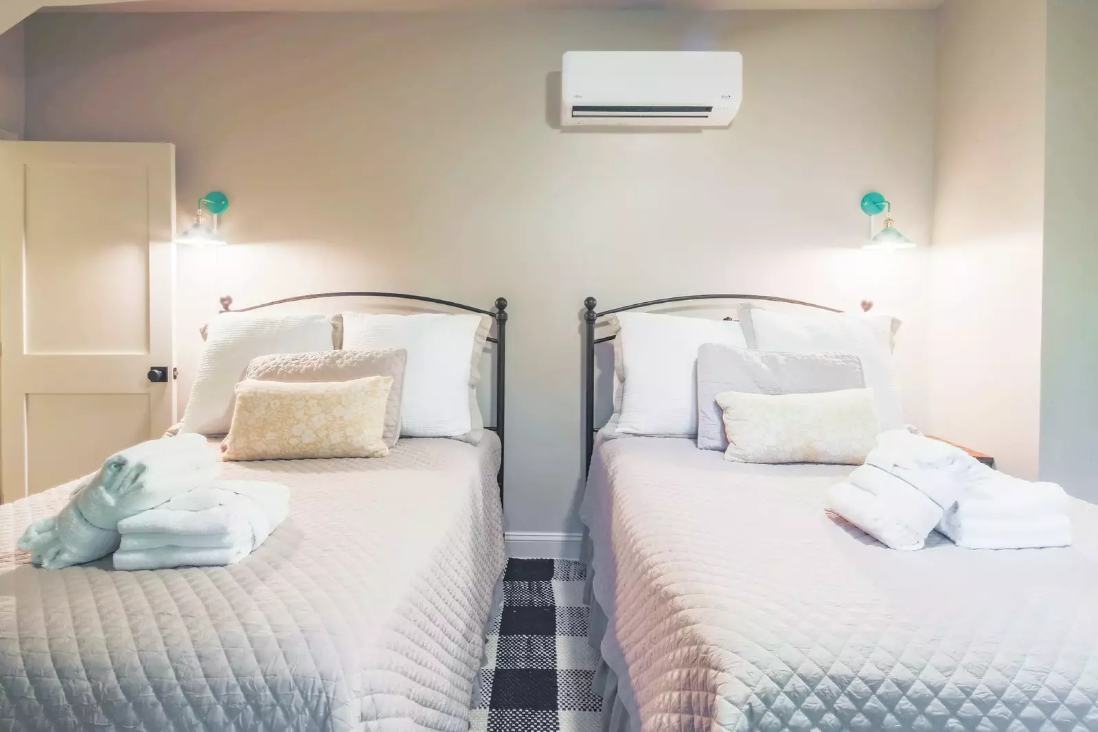 This bedroom features two full beds.