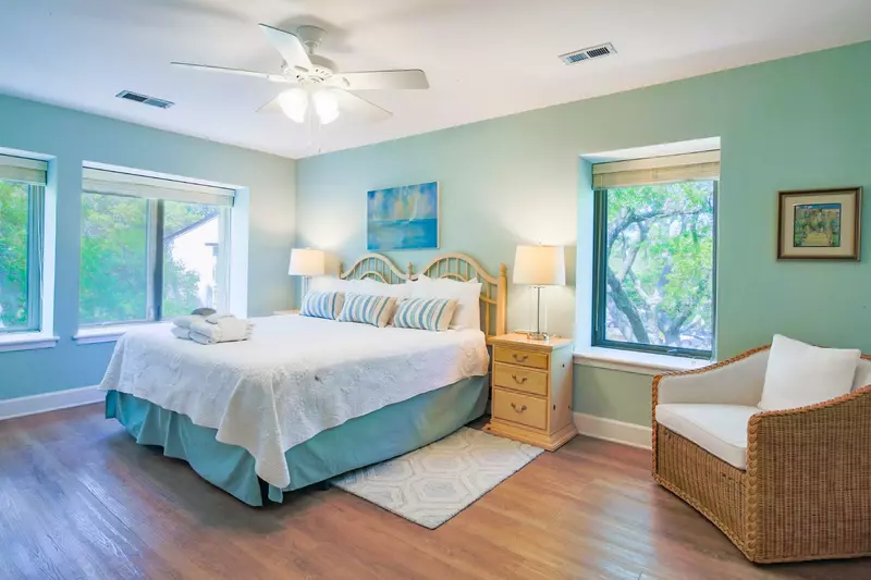 The master suite receives lovely natural light.
