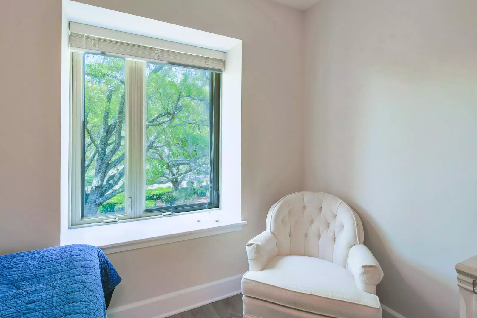 The guest bedroom also has this cozy arm chair near the window.