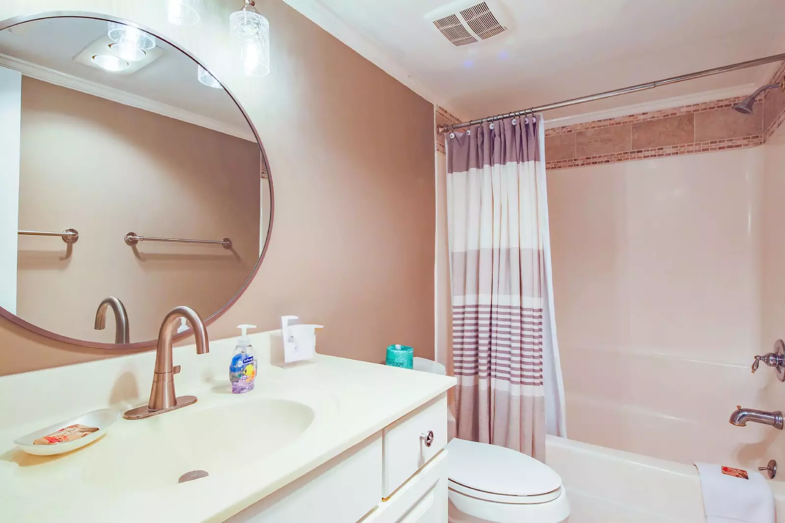 The hallway bathroom features a spacious vanity and a shower/tub combo.