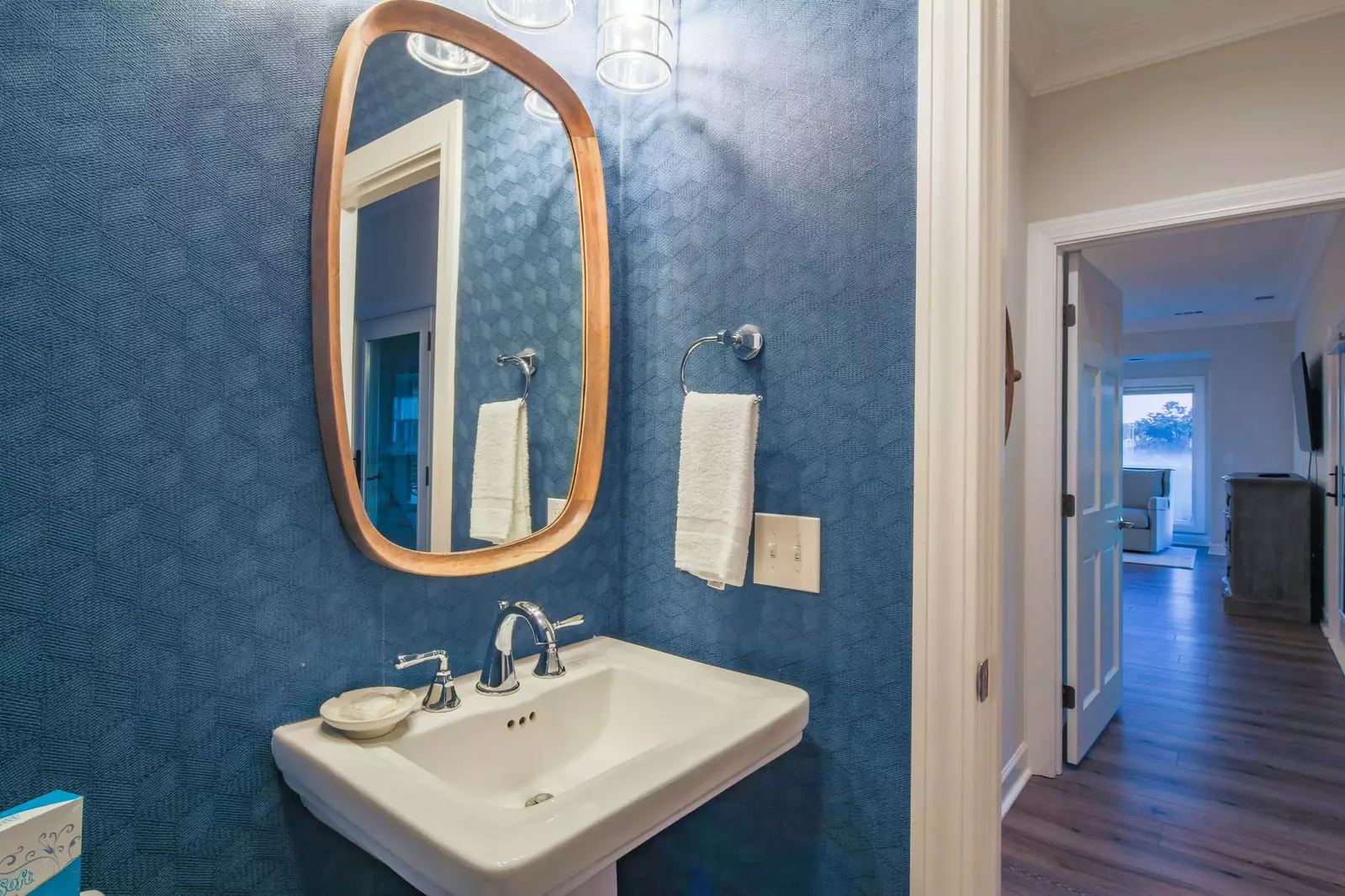 This half bathroom is located near the living room and master suite.