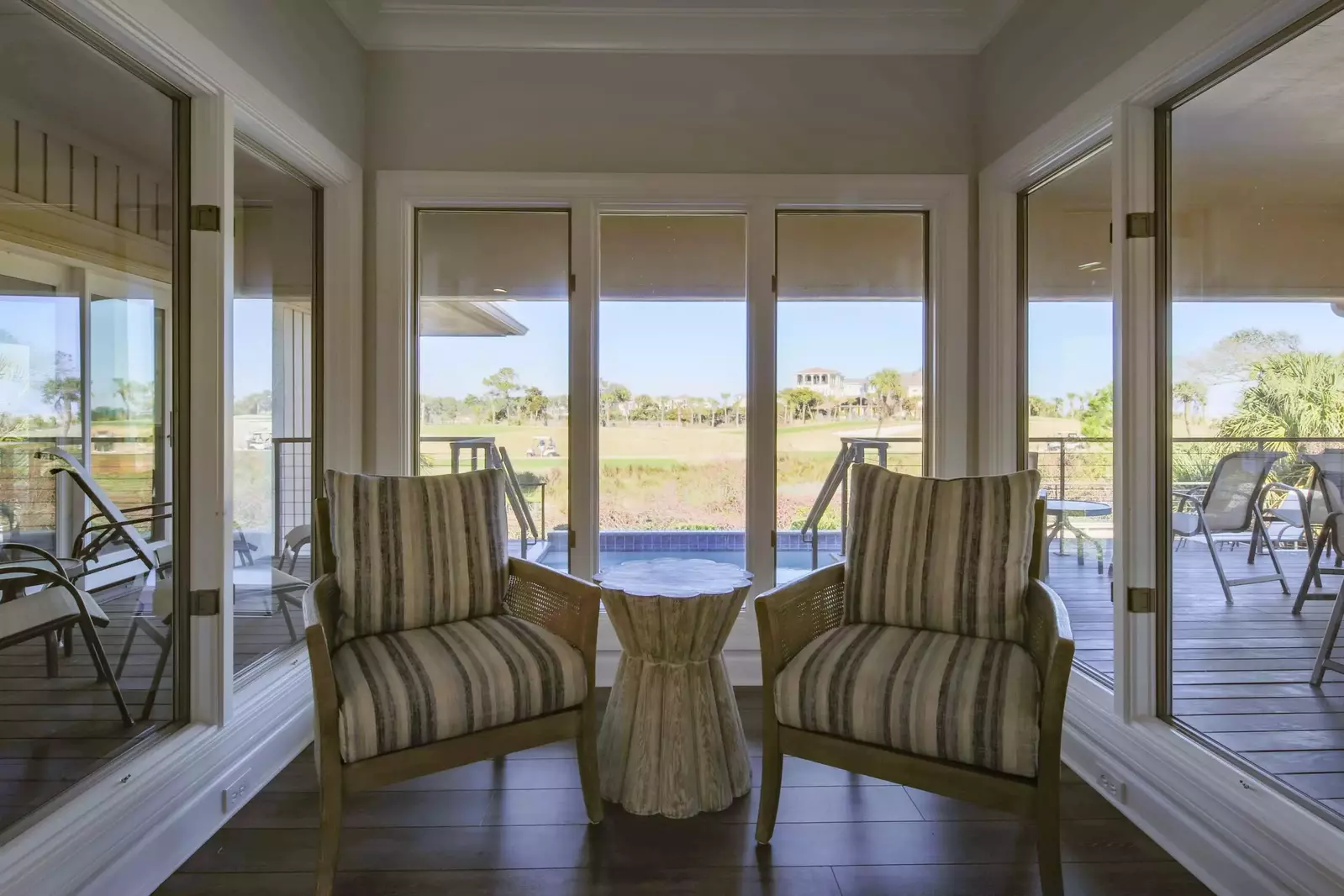 The living room also features views of the back deck and 10th hole of the Robert Trent Golf Course.