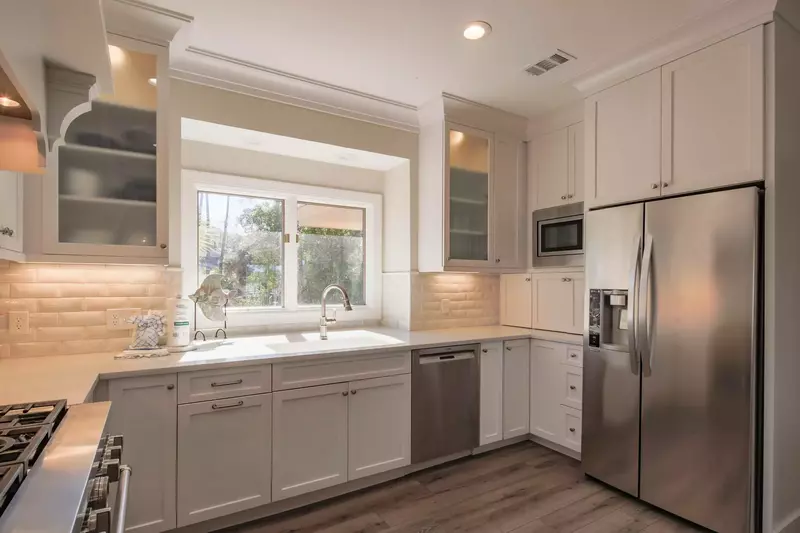 The kitchen also features stainless steel appliances.