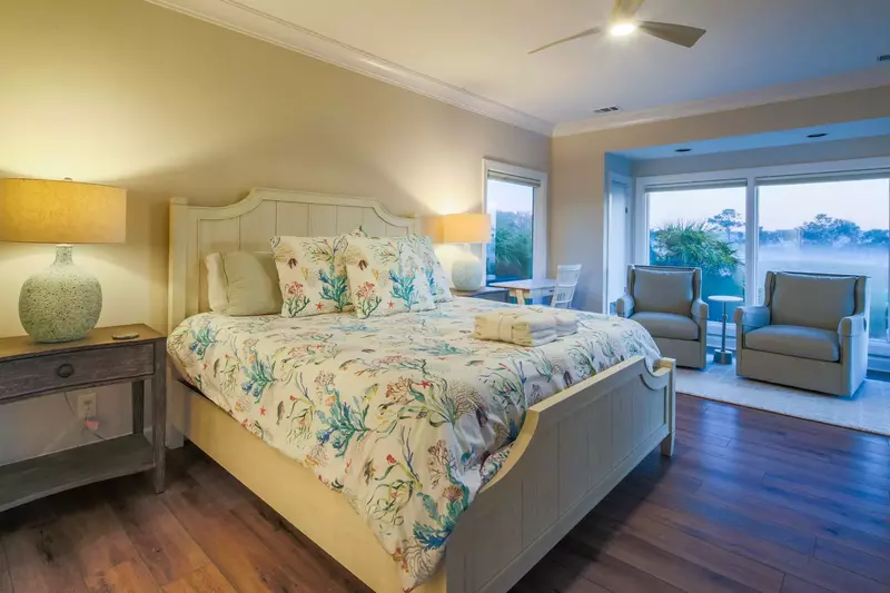 The master suite is located on the home's lower level off of the living room.