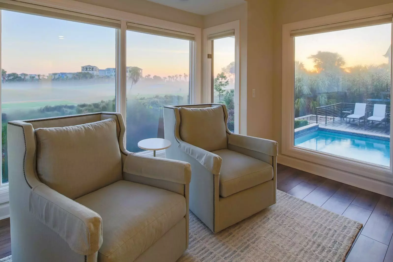 There are also two armchairs and views of the pool, sundeck and Robert Trent Jones golf course.
