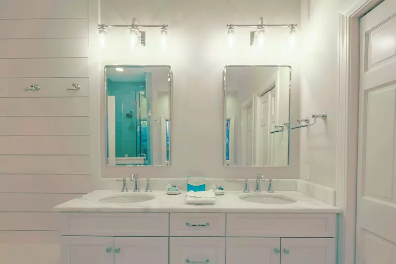 The en suite bathroom for the master suite features a dual sink vanity.