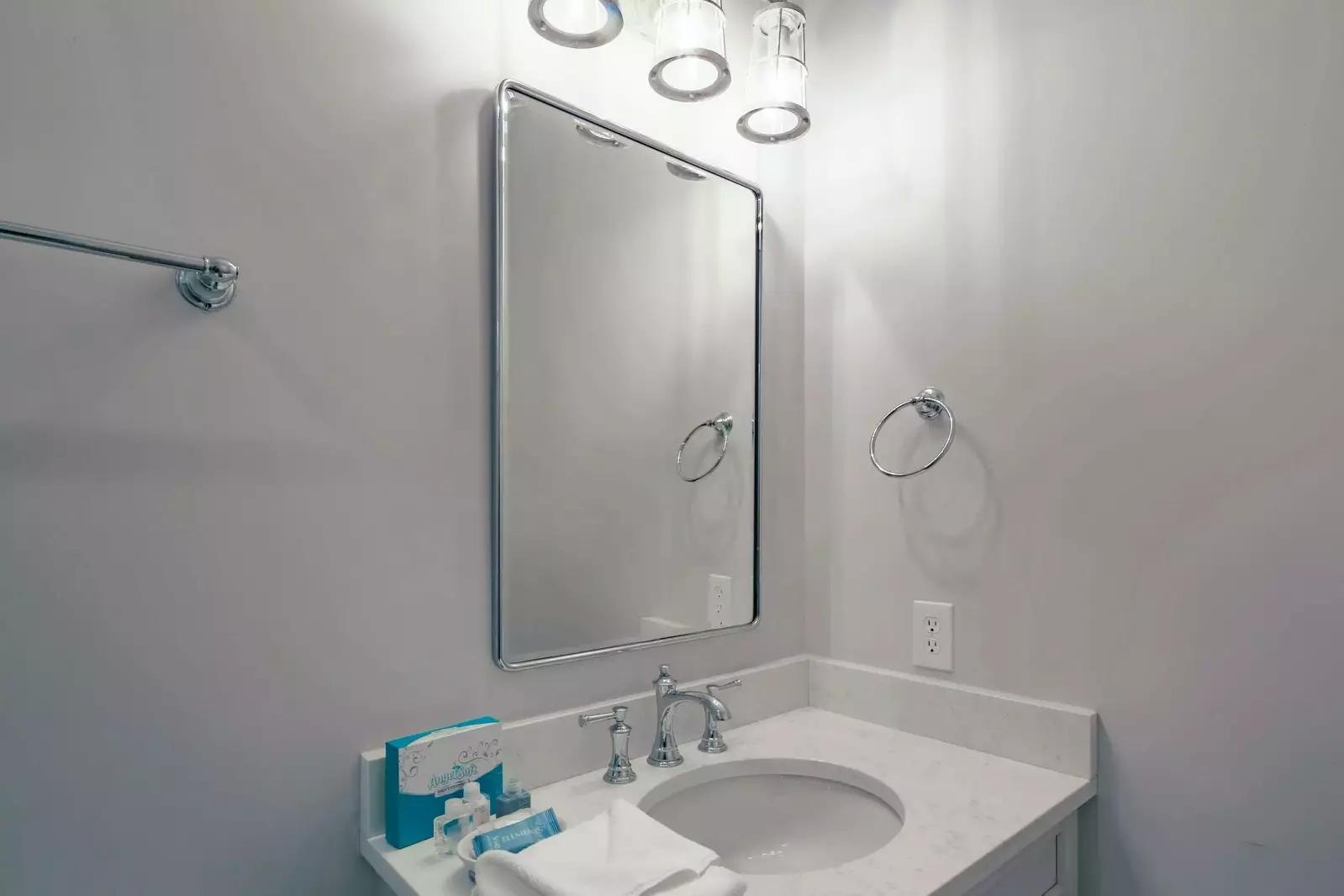 The en suite bathroom for the second master suite has a spacious vanity.