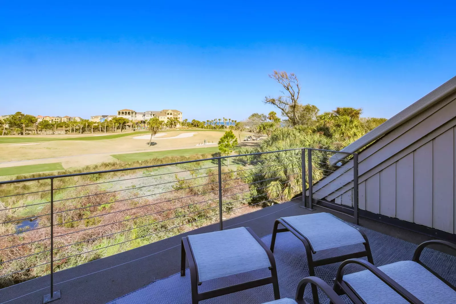 The second floor balcony is the perfect spot to watch the golfers or enjoy the ocean breezes.