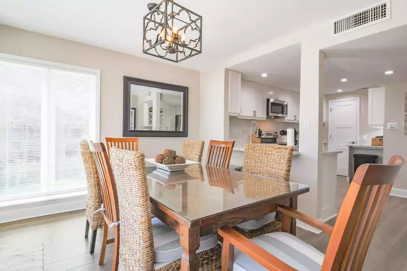 The dining area, which seats 8, opens into the renovated kitchen.