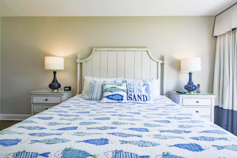 The master suite, which is located on the first floor, features a king bed.