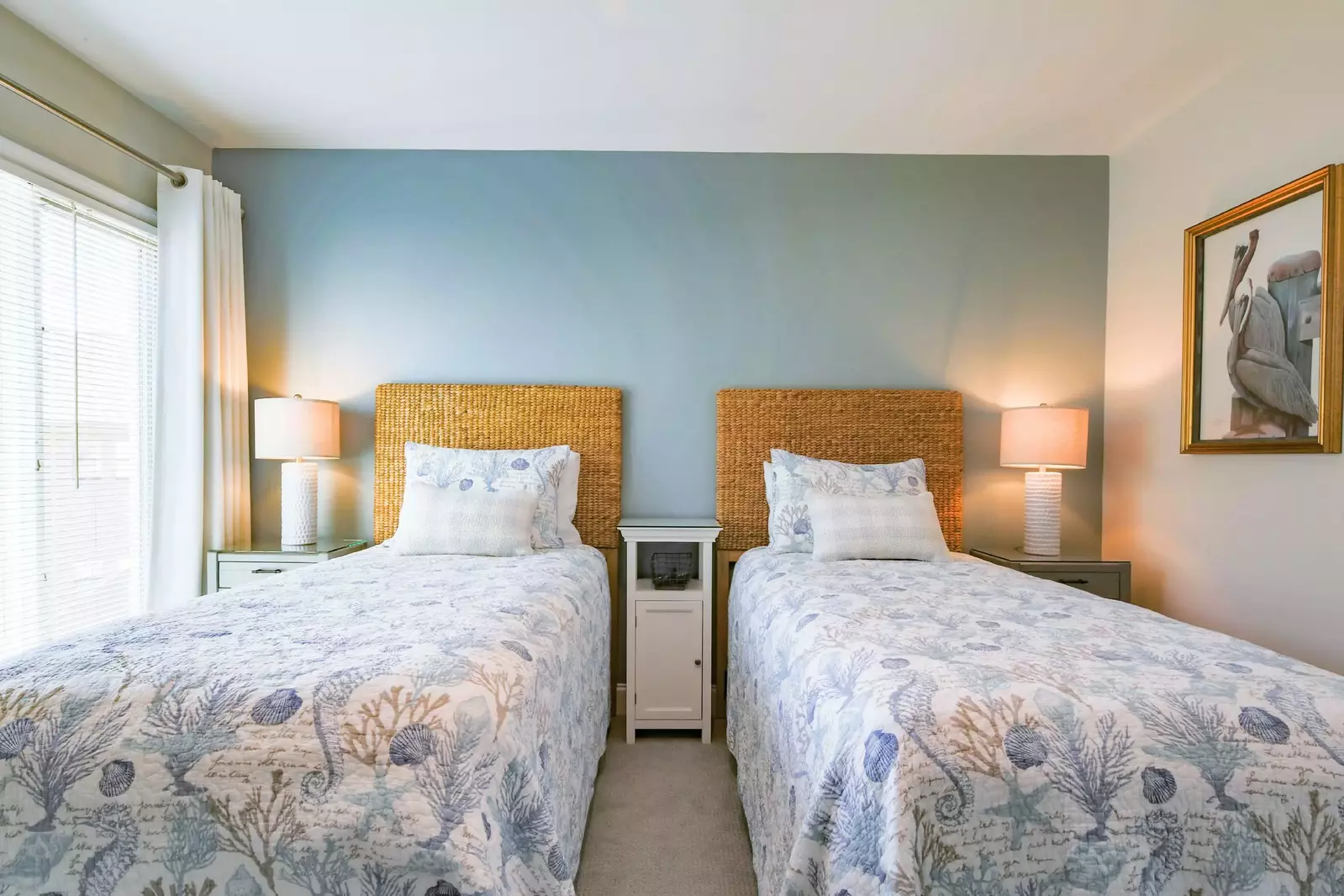 The twin suite features three night stands and two reading lamps.
