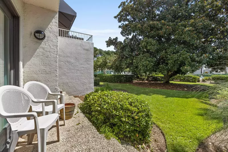 The Pool is just beyond the large magnolia tree.