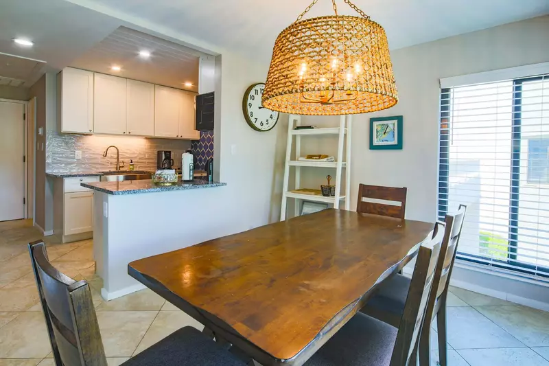 The dining table near the kitchen seats 6.