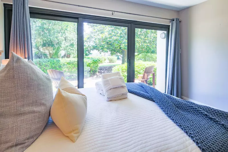 This two suites on the lowest level of the home feature sliding door access to the back patio.