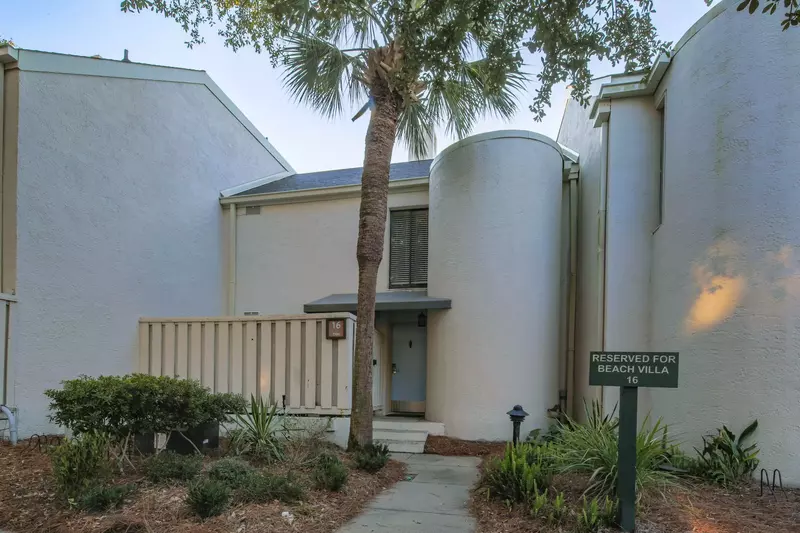 Follow the signage and sidewalk to access the front door of this beach villa.