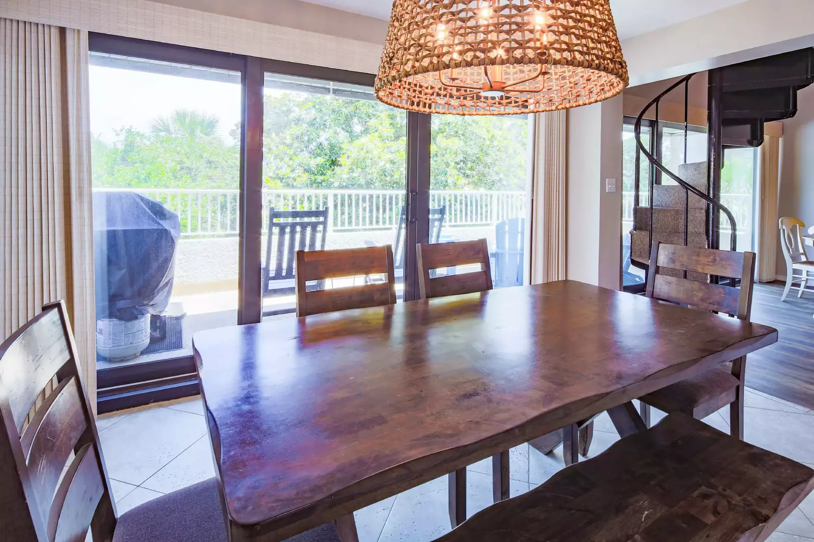 The dining area features lovely natural light through the large sliding glass doors to the back porch.