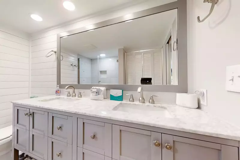 The en suite bathroom for the master suite features a double sink vanity.