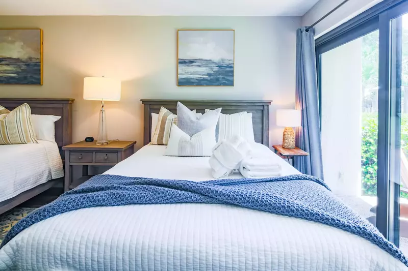 This guest suite receives lovely natural light through the large windows.