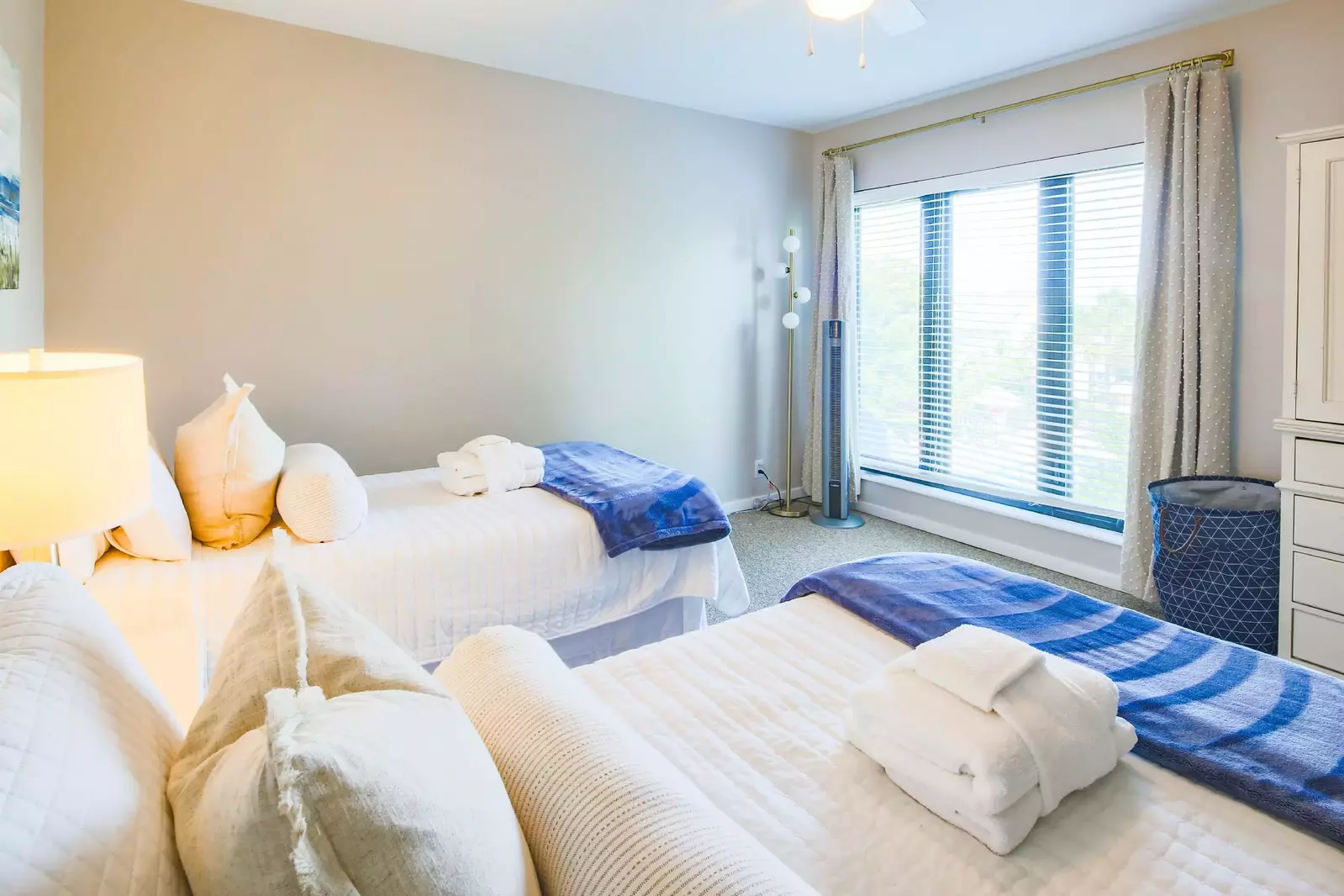 This room receives lovely natural light through its large window with views of the ocean.