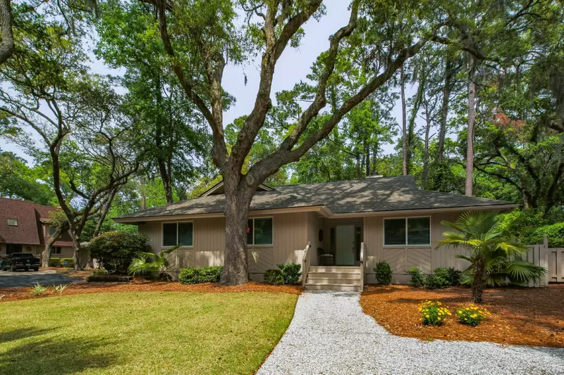 Come Sail Away is a single story home within the maritime forest of Sea Pines Resort.