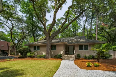 Come Sail Away is a single story home within the maritime forest of Sea Pines Resort.