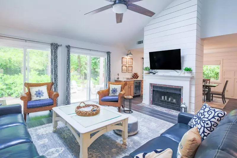 The living room also opens onto the backyard oasis through these sliding glass doors.