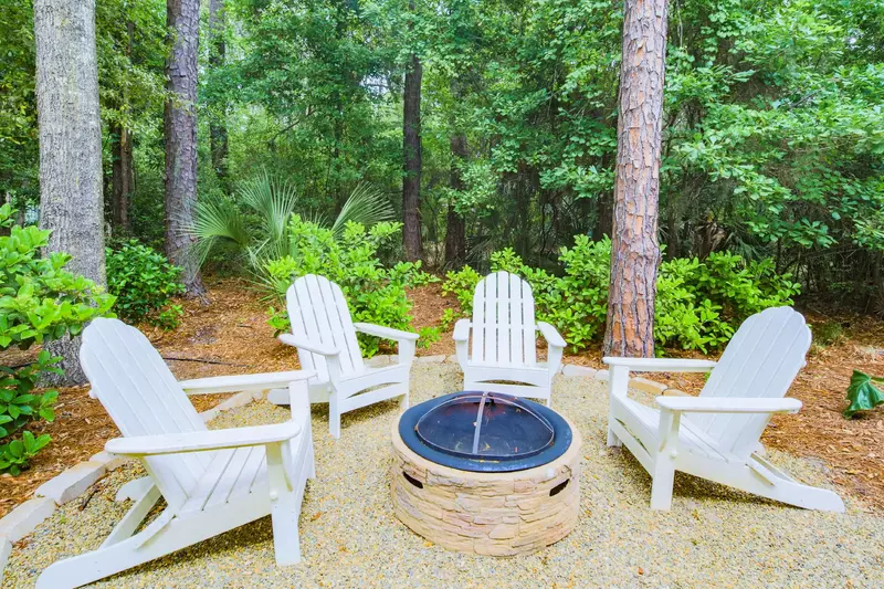 Our adirondack chairs and fire pit are tucked away beneath a canopy of beautiful pines, oaks and palmettos.