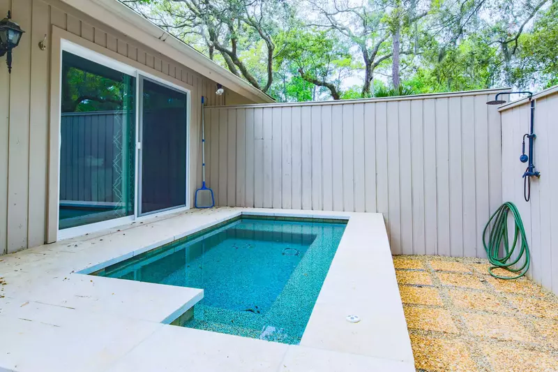The home's private hot tub and outdoor shower iare also in the backyard.
