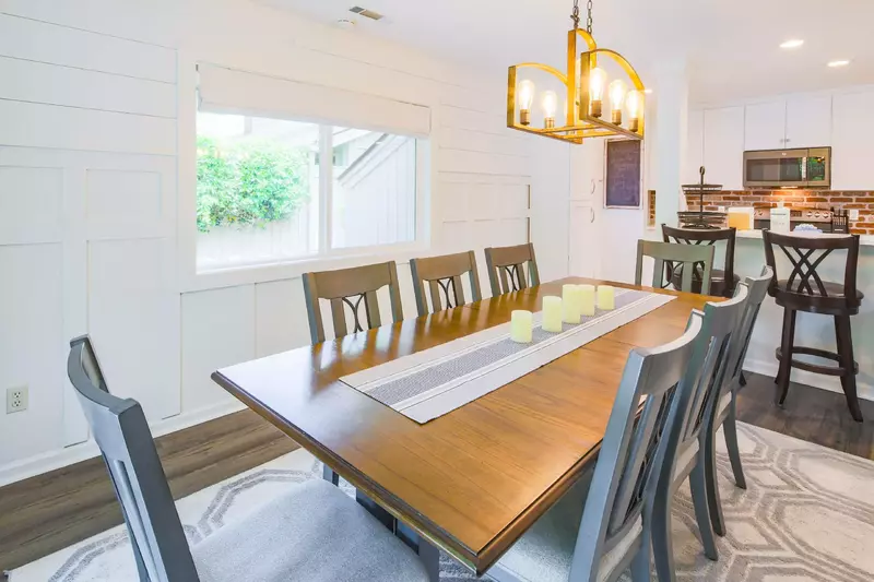 The walls in the dining room have both shiplap and wainscoting for a clean, coastal look.