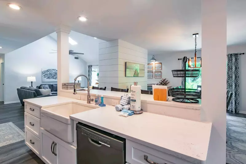 The open floor plan layout between the kitchen, living room and dining area make it easy to interact with your guests.